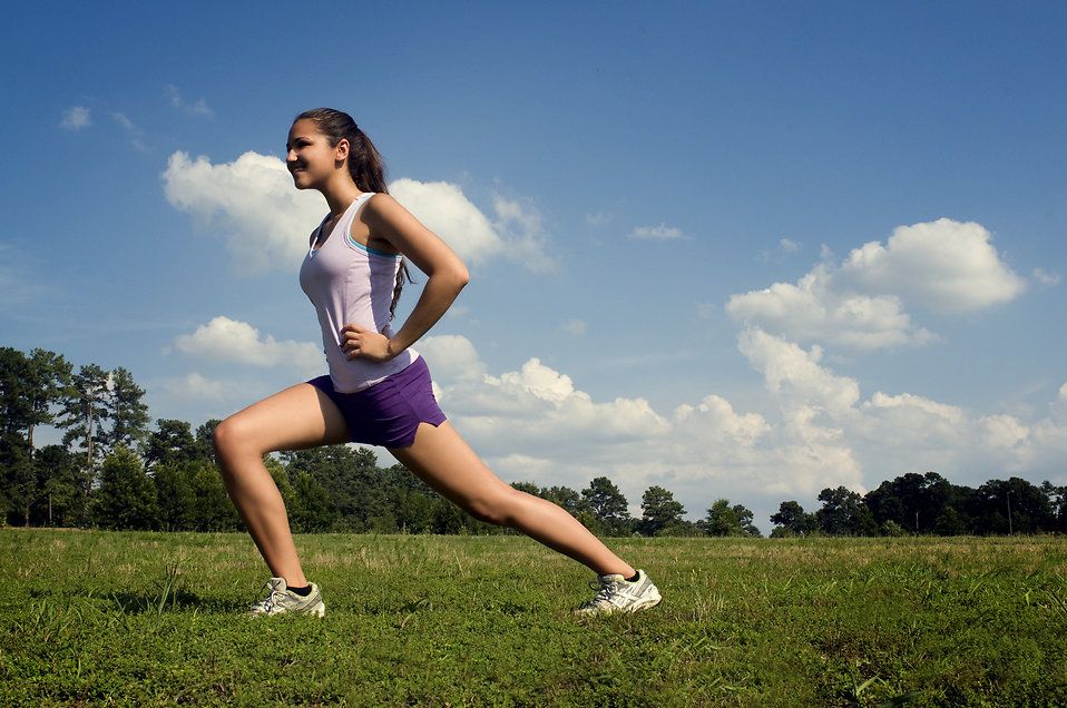 photo 15250-a-young-woman-stretching-outdoors-before-exercising-pv_zpsqo7hhj9n.jpg