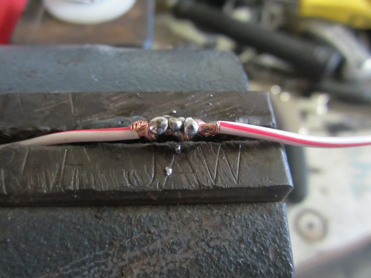 Apply solder to the inline fuse holder and power wires